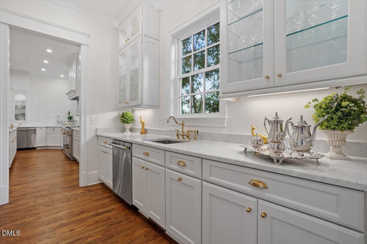 1713 Oberlin Road Raleigh, NC 27608 - Photo 22 of 53 a kitchen with sink and cabinets