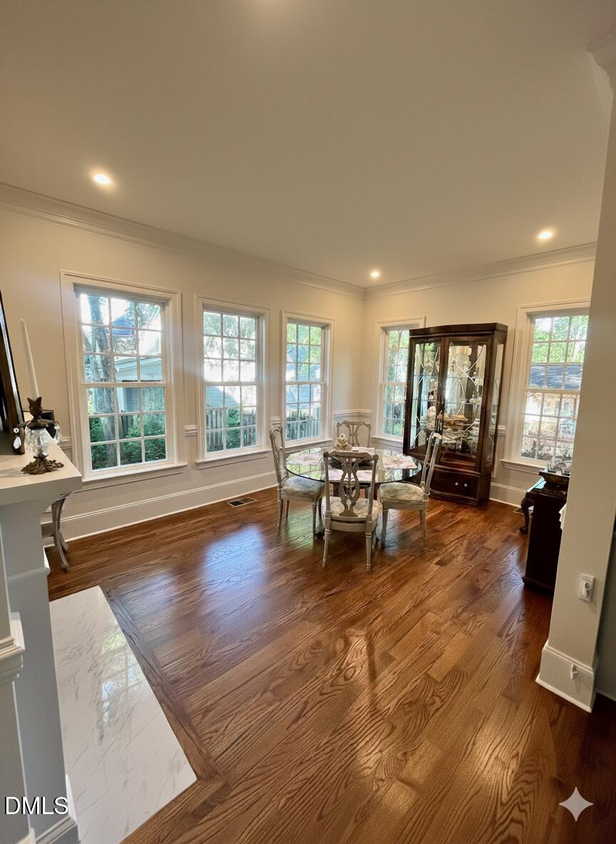1713 Oberlin Road Raleigh, NC 27608 - Photo 23 of 53 a living room with furniture and large windows