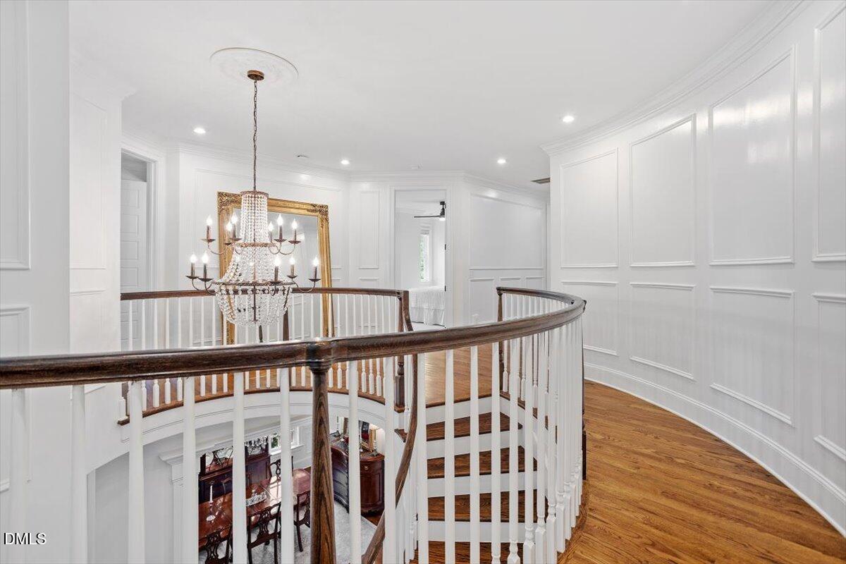 1713 Oberlin Road Raleigh, NC 27608 - Photo 26 of 53 a view of a hallway with wooden floor and staircase