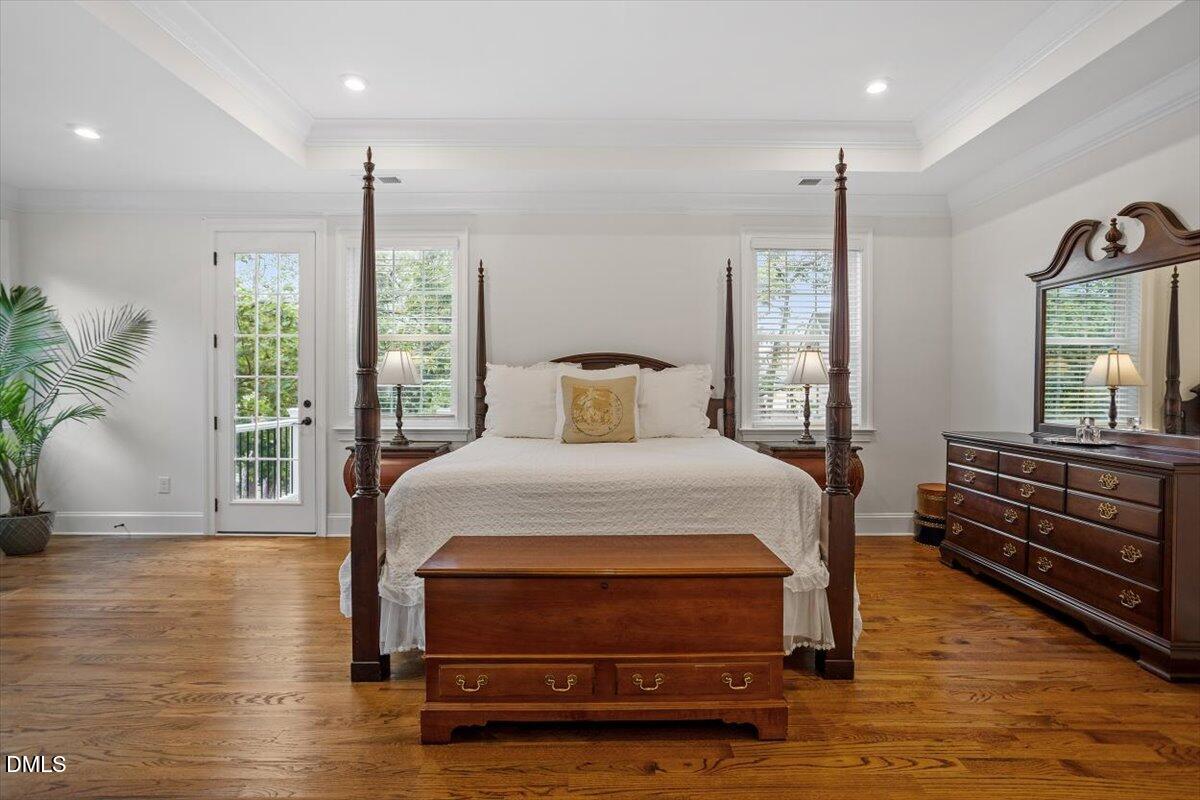 1713 Oberlin Road Raleigh, NC 27608 - Photo 27 of 53 a bedroom with a bed and wooden floor