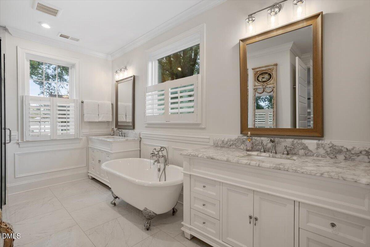 1713 Oberlin Road Raleigh, NC 27608 - Photo 31 of 53 a bathroom with a granite countertop sink mirror and bathtub