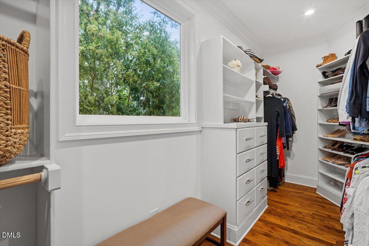 1713 Oberlin Road Raleigh, NC 27608 - Photo 33 of 53 a view of walk in closet with clothes and shoes