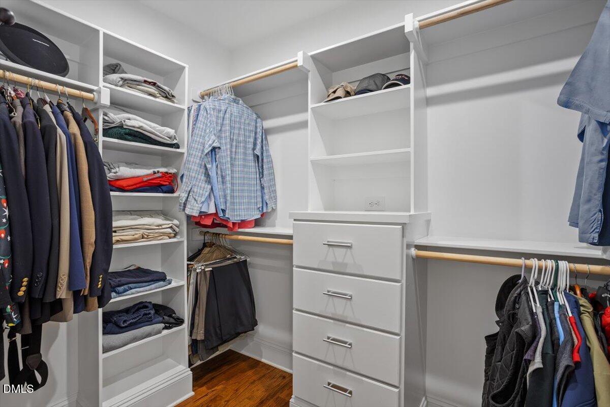 1713 Oberlin Road Raleigh, NC 27608 - Photo 34 of 53 a view of walk in closet with clothes and shoes