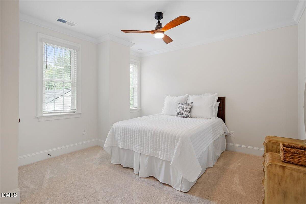 1713 Oberlin Road Raleigh, NC 27608 - Photo 36 of 53 a bedroom with a bed and a window