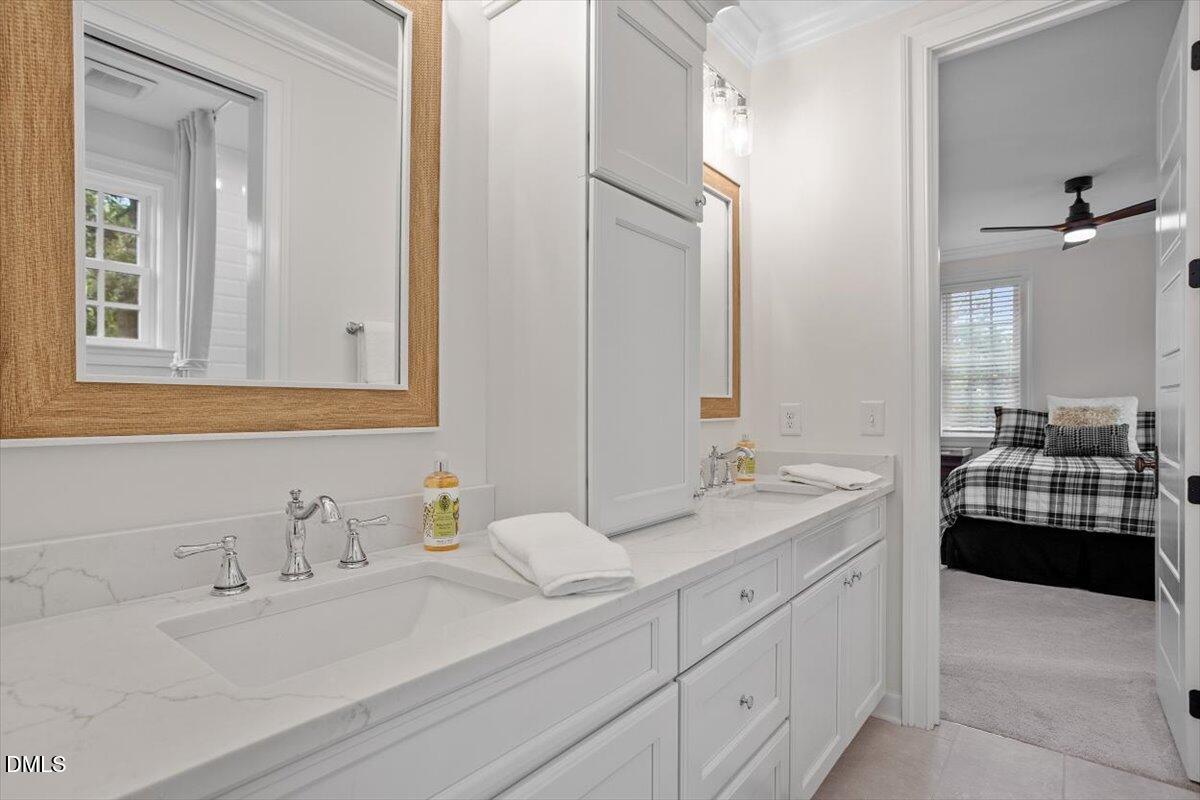 1713 Oberlin Road Raleigh, NC 27608 - Photo 39 of 53 a bathroom with a sink and a mirror