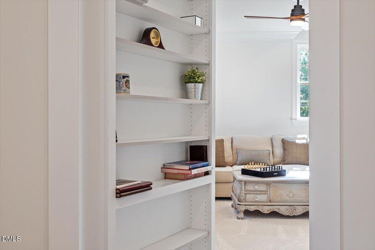 1713 Oberlin Road Raleigh, NC 27608 - Photo 46 of 53 a living room with stainless steel appliances kitchen island a table and chairs in it