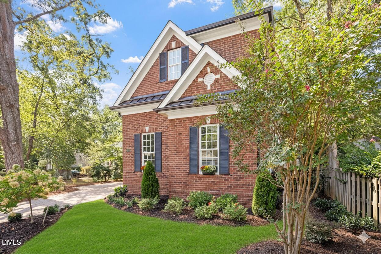 1713 Oberlin Road Raleigh, NC 27608 - Photo 50 of 53 a front view of a house with garden