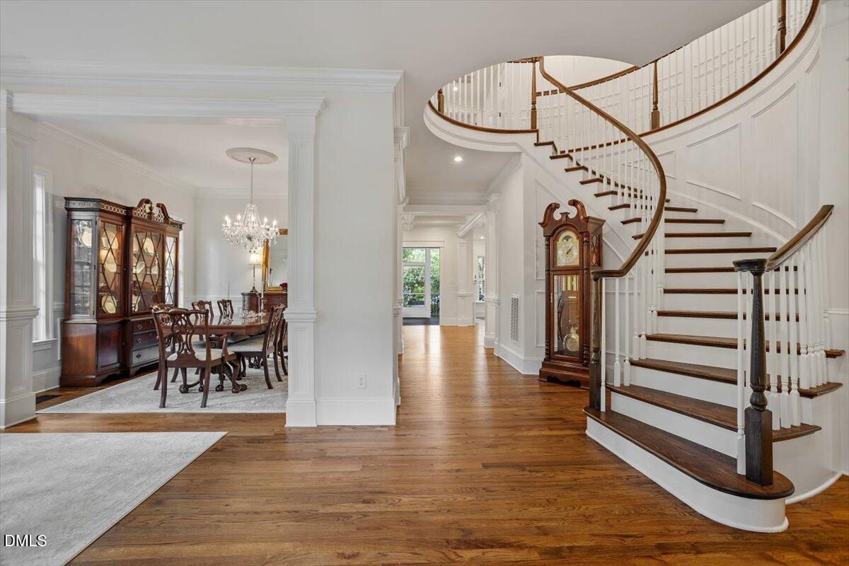 1713 Oberlin Road Raleigh, NC 27608 - Photo 6 of 53 a view of a dining room with furniture wooden floor and a rug