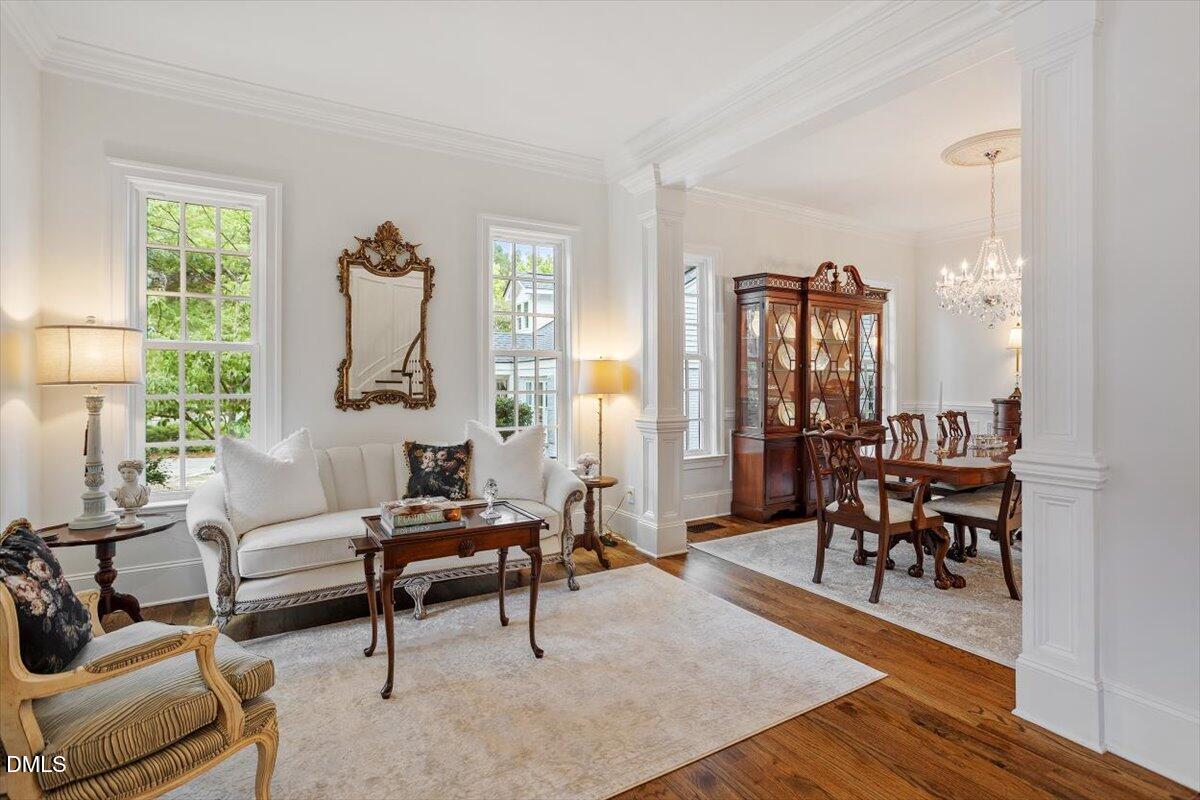 1713 Oberlin Road Raleigh, NC 27608 - Photo 8 of 53 a living room with furniture and a wooden floor