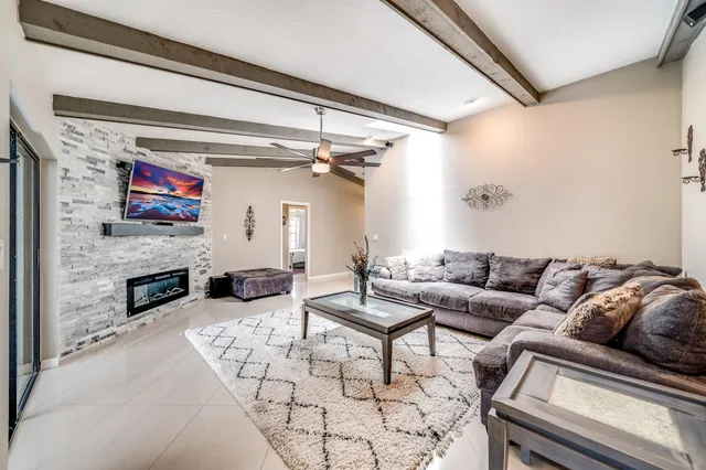 a living room with furniture and a large window