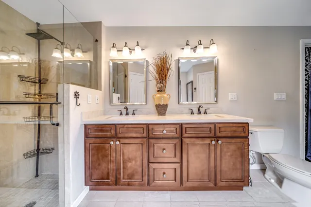 a dining room with furniture and a floor to ceiling window