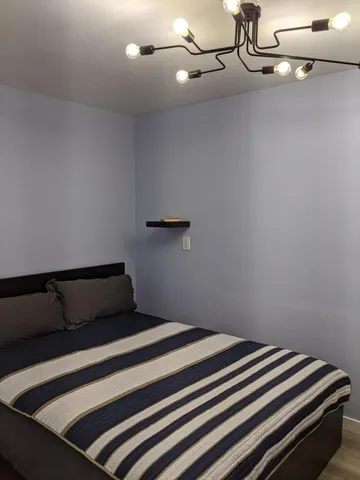 a bathroom with a sink a mirror a vanity and shower