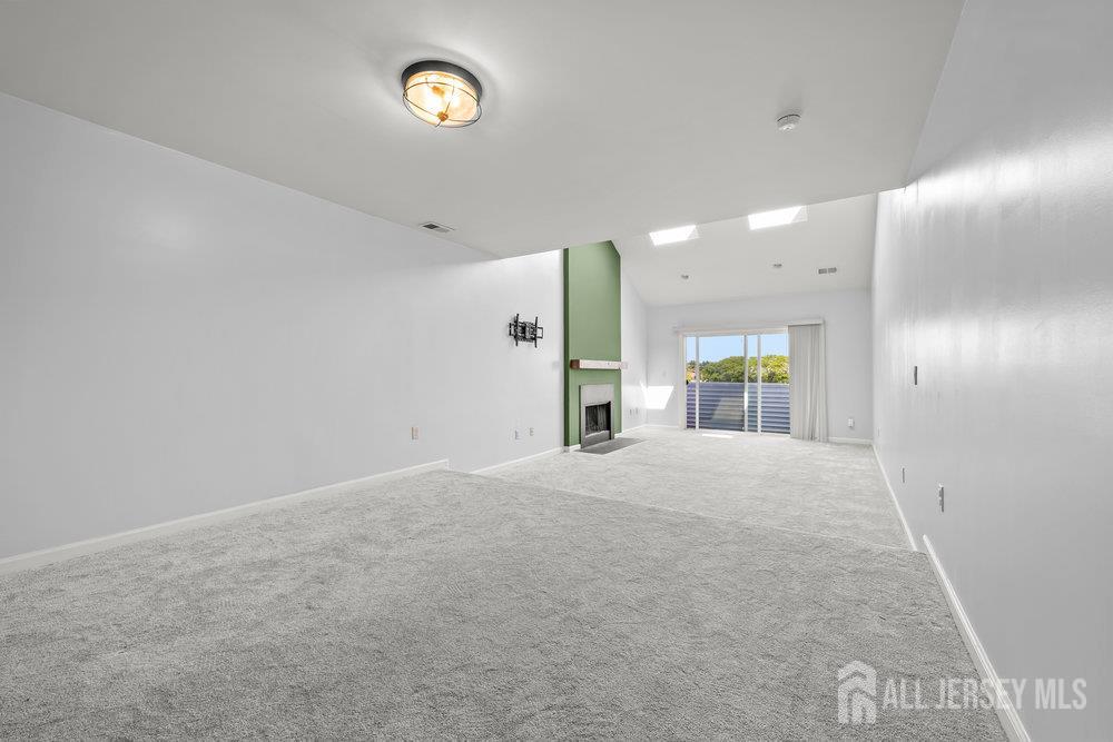 806 Jesse Way Piscataway, NJ 08854 - Photo 2 of 8 a view of a livingroom with a fireplace