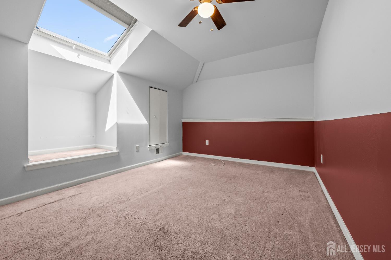 806 Jesse Way Piscataway, NJ 08854 - Photo 6 of 8 an empty room with windows and fan