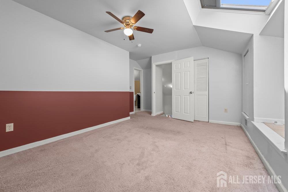 806 Jesse Way Piscataway, NJ 08854 - Photo 7 of 8 an empty room with closet and fan
