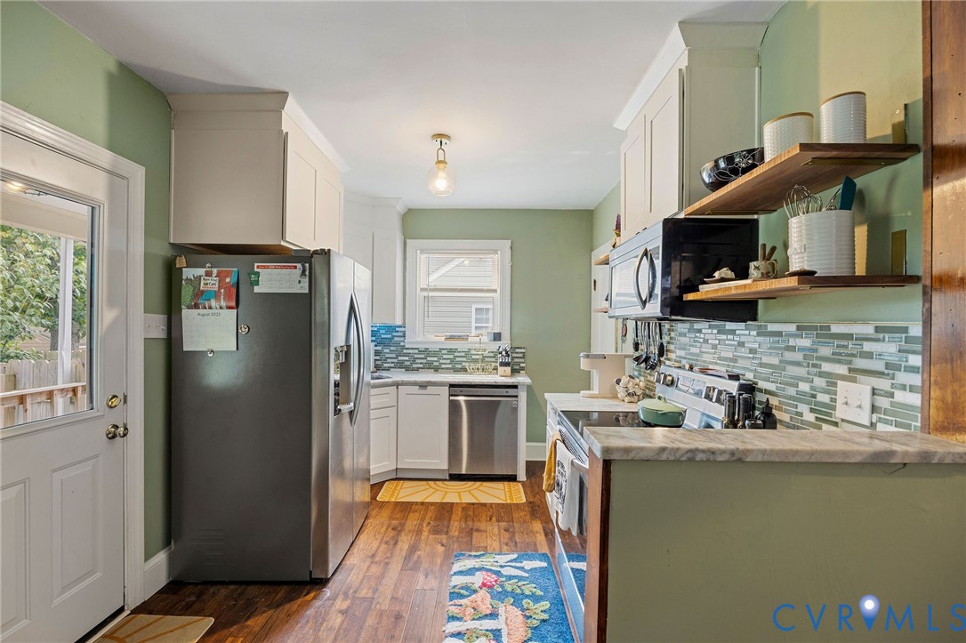 2519 Maplewood Road Henrico, VA 23228 - Photo 14 of 41 a kitchen with stainless steel appliances granite countertop a refrigerator a stove top oven a sink and dishwasher