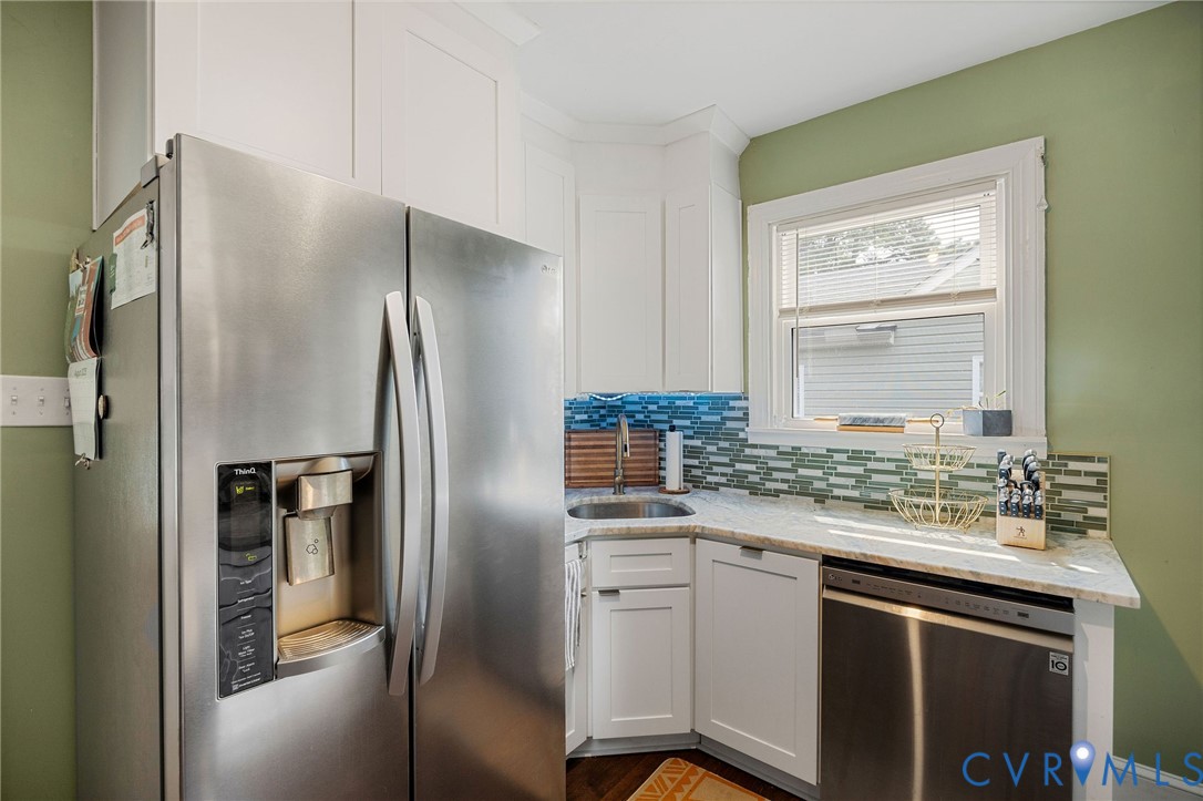 2519 Maplewood Road Henrico, VA 23228 - Photo 17 of 41 a kitchen with stainless steel appliances granite countertop a refrigerator and a sink