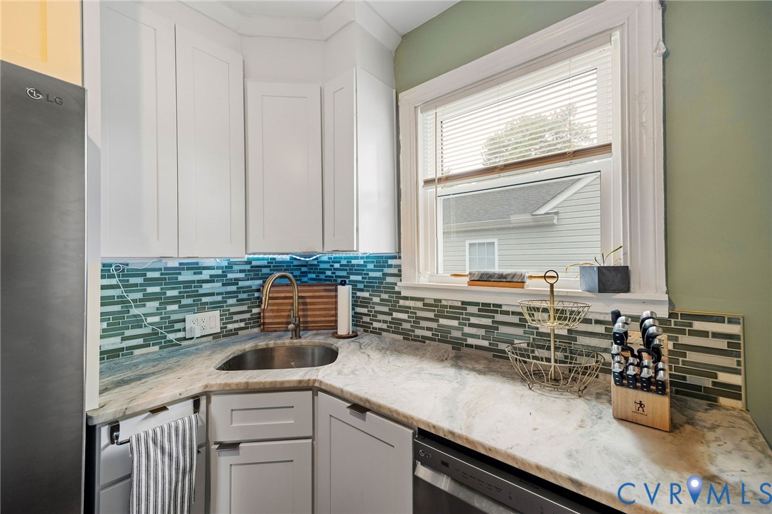 2519 Maplewood Road Henrico, VA 23228 - Photo 18 of 41 a kitchen with a sink and cabinets