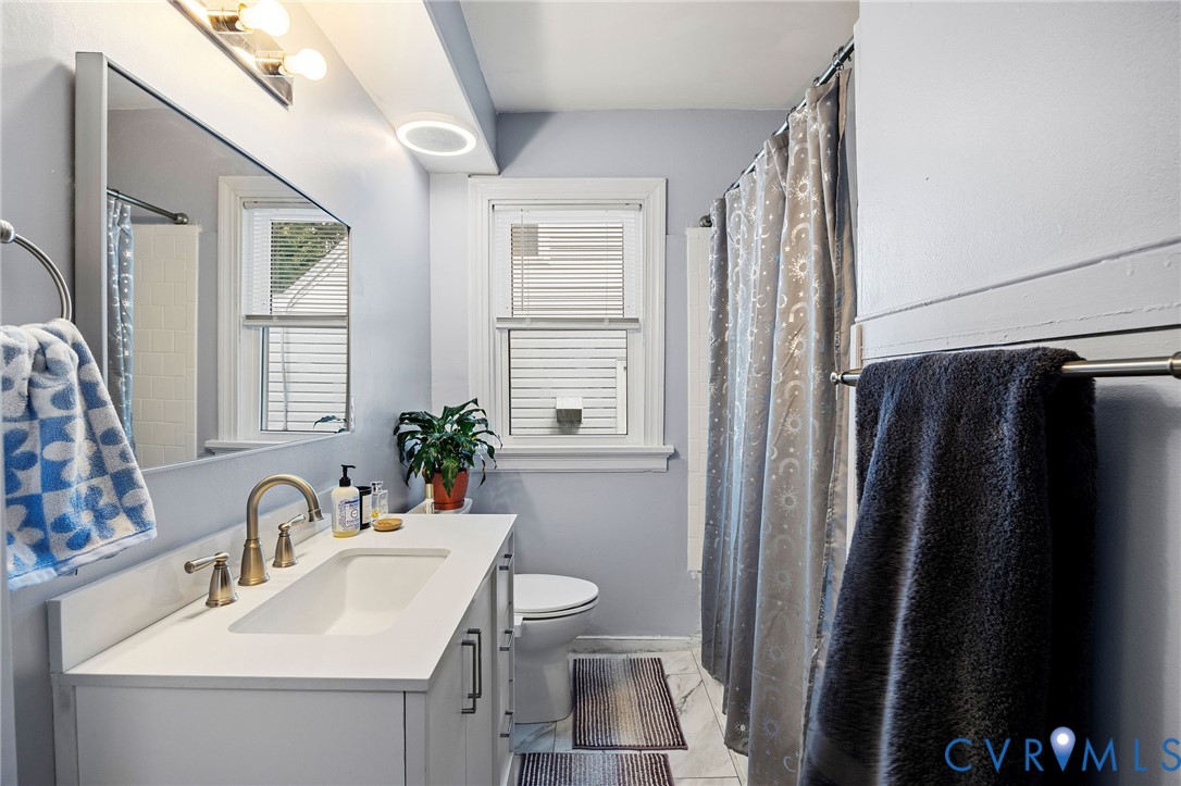 2519 Maplewood Road Henrico, VA 23228 - Photo 23 of 41 a bathroom with a sink toilet and shower