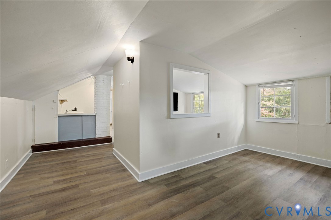 2519 Maplewood Road Henrico, VA 23228 - Photo 26 of 41 an empty room with wooden floor and windows