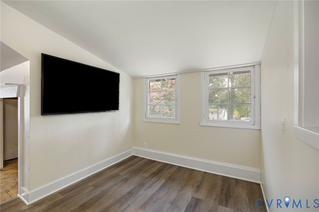 2519 Maplewood Road Henrico, VA 23228 - Photo 28 of 41 a view of a livingroom with wooden floor and flat screen tv