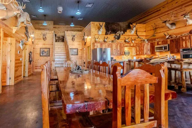 a bathroom with a double vanity sink a mirror and shower
