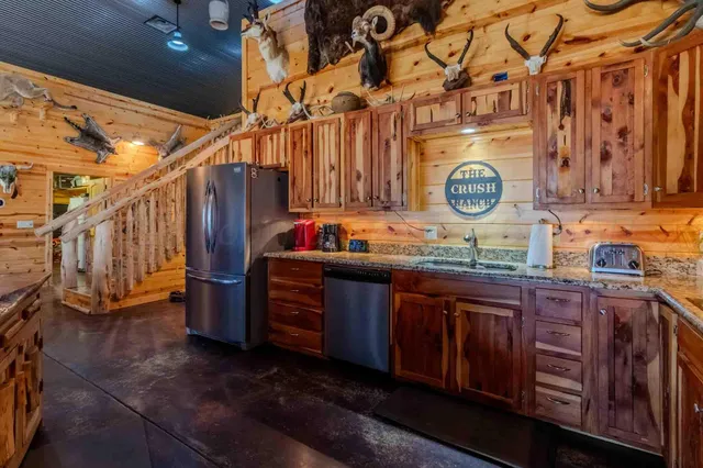 a view of a house with a yard and sitting area