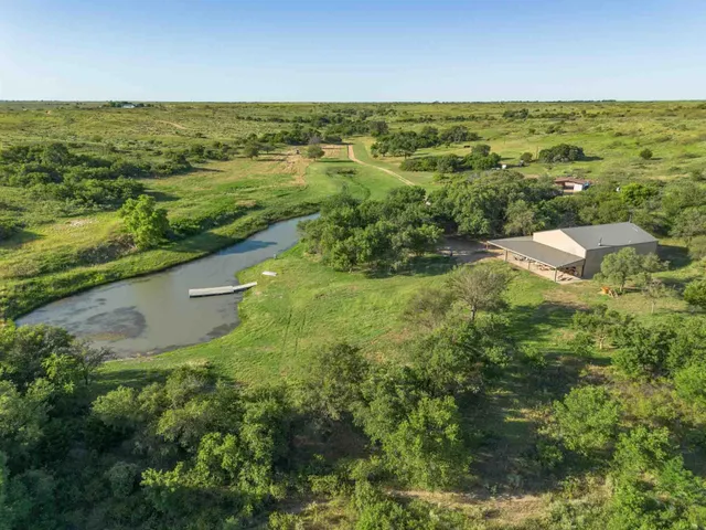a view of a house with backyard porch and sitting area