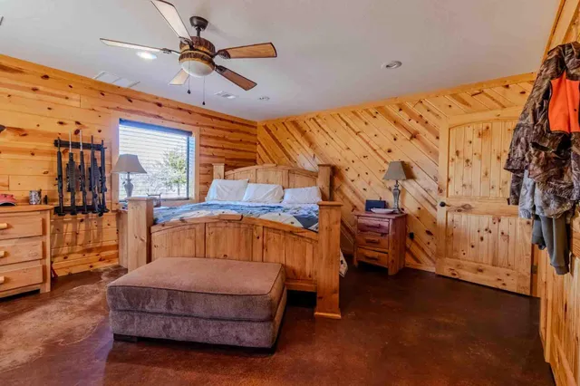 a view of a field of grass and trees