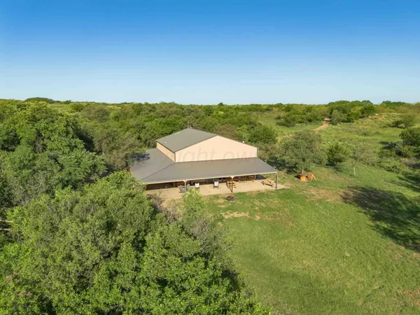 a view of a lake with a yard