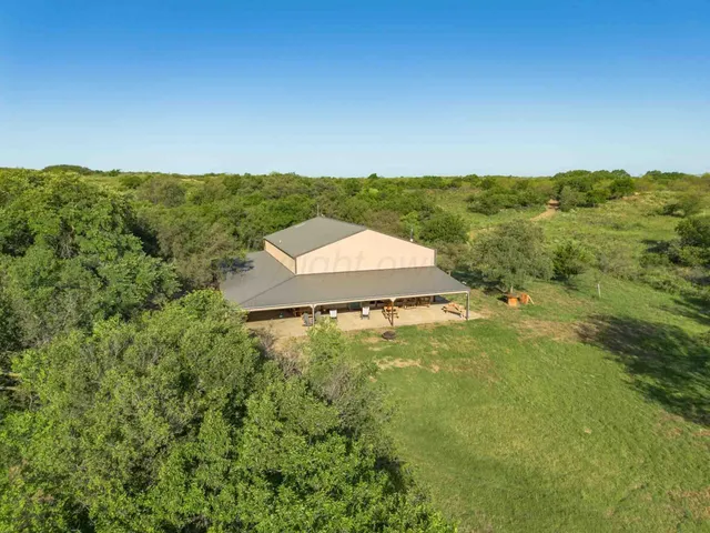 a view of a lake with a yard