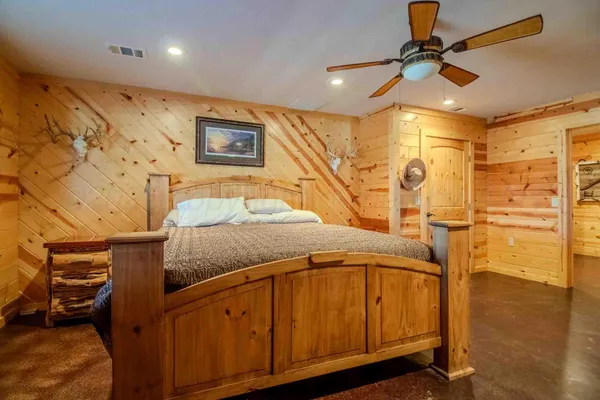 a view of house with yard and furniture