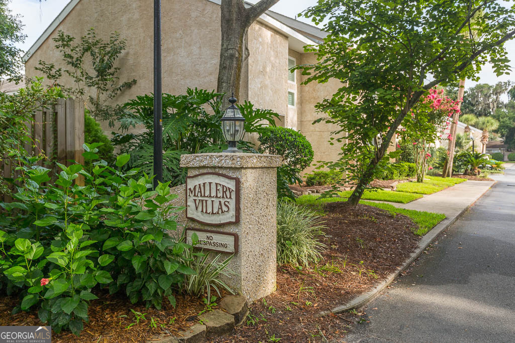 1000 Mallery Street, Unit D27 St. Simons, GA 31522 - Photo 11 of 34 a sign that is sitting on a brick wall