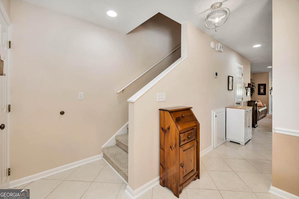 1000 Mallery Street, Unit D27 St. Simons, GA 31522 - Photo 13 of 34 a view of kitchen with furniture and refrigerator