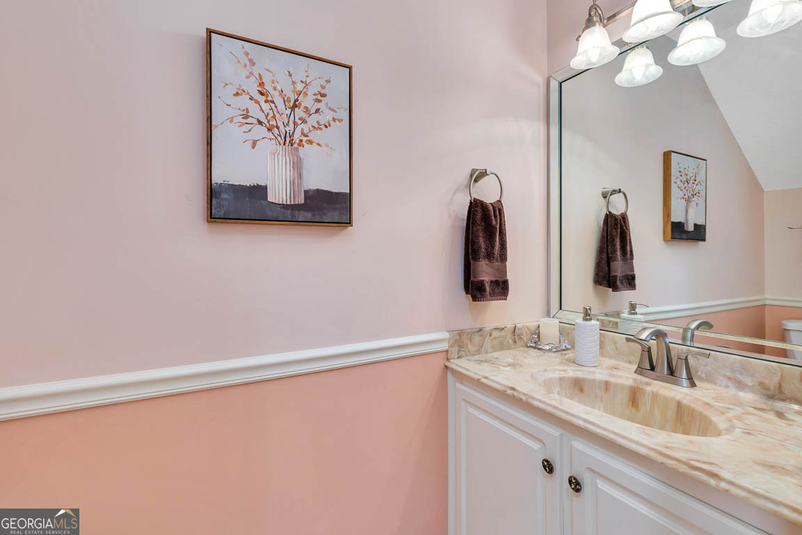 1000 Mallery Street, Unit D27 St. Simons, GA 31522 - Photo 20 of 34 a bathroom with a sink and a mirror