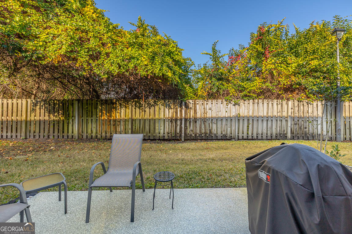 1000 Mallery Street, Unit D27 St. Simons, GA 31522 - Photo 29 of 34 a view of backyard with seating area and trees