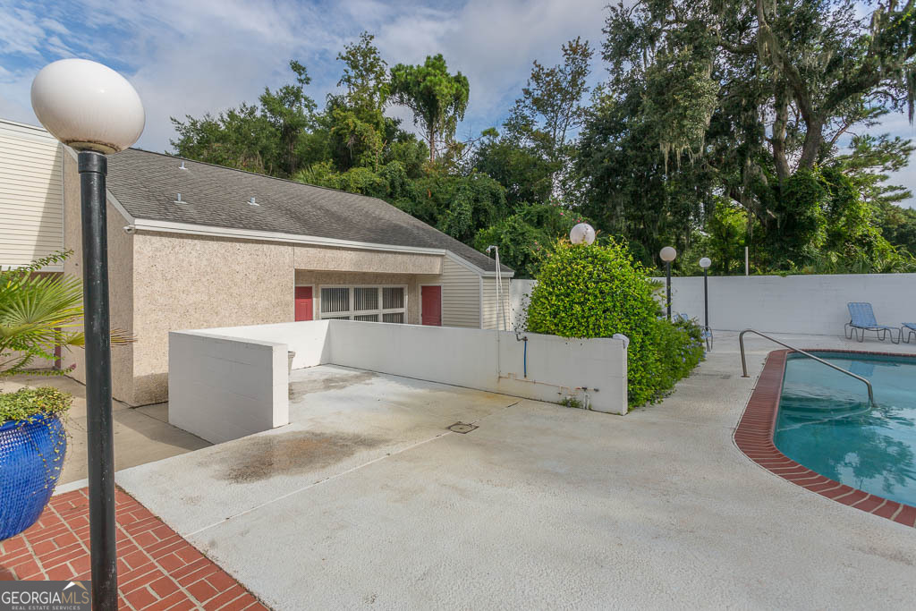 1000 Mallery Street, Unit D27 St. Simons, GA 31522 - Photo 34 of 34 a view of a house with a patio and a yard