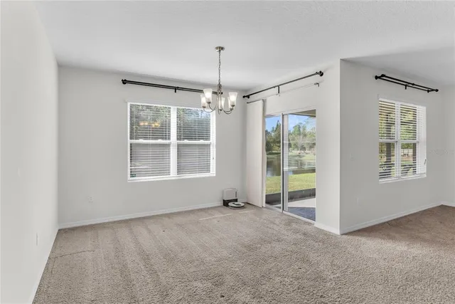 a view of livingroom with window hardwood floor and ceiling fan