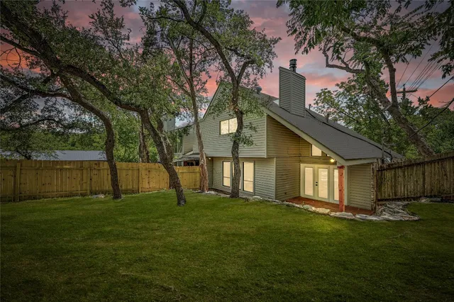 a view of front of house with a yard