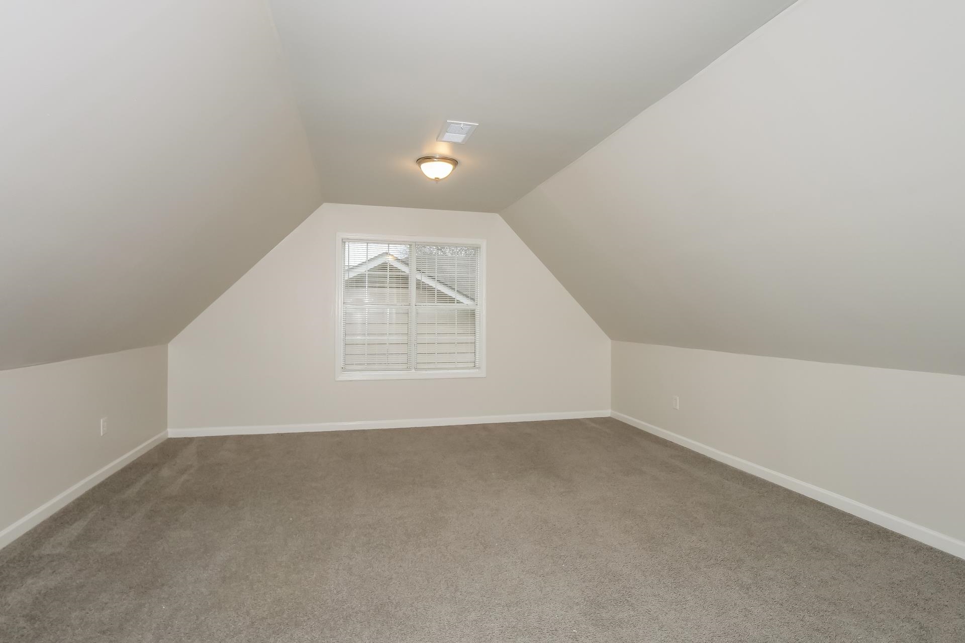 4696 Crestfield Road Millington, TN 38053 - Photo 12 of 17 Bonus room featuring carpet and vaulted ceiling