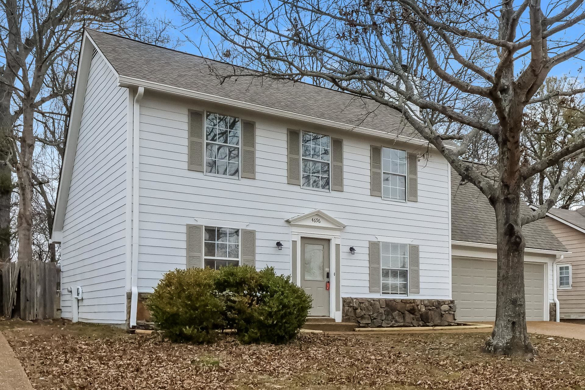 4696 Crestfield Road Millington, TN 38053 - Photo 2 of 17 Colonial home with a shingled roof, concrete driveway, and an attached garage