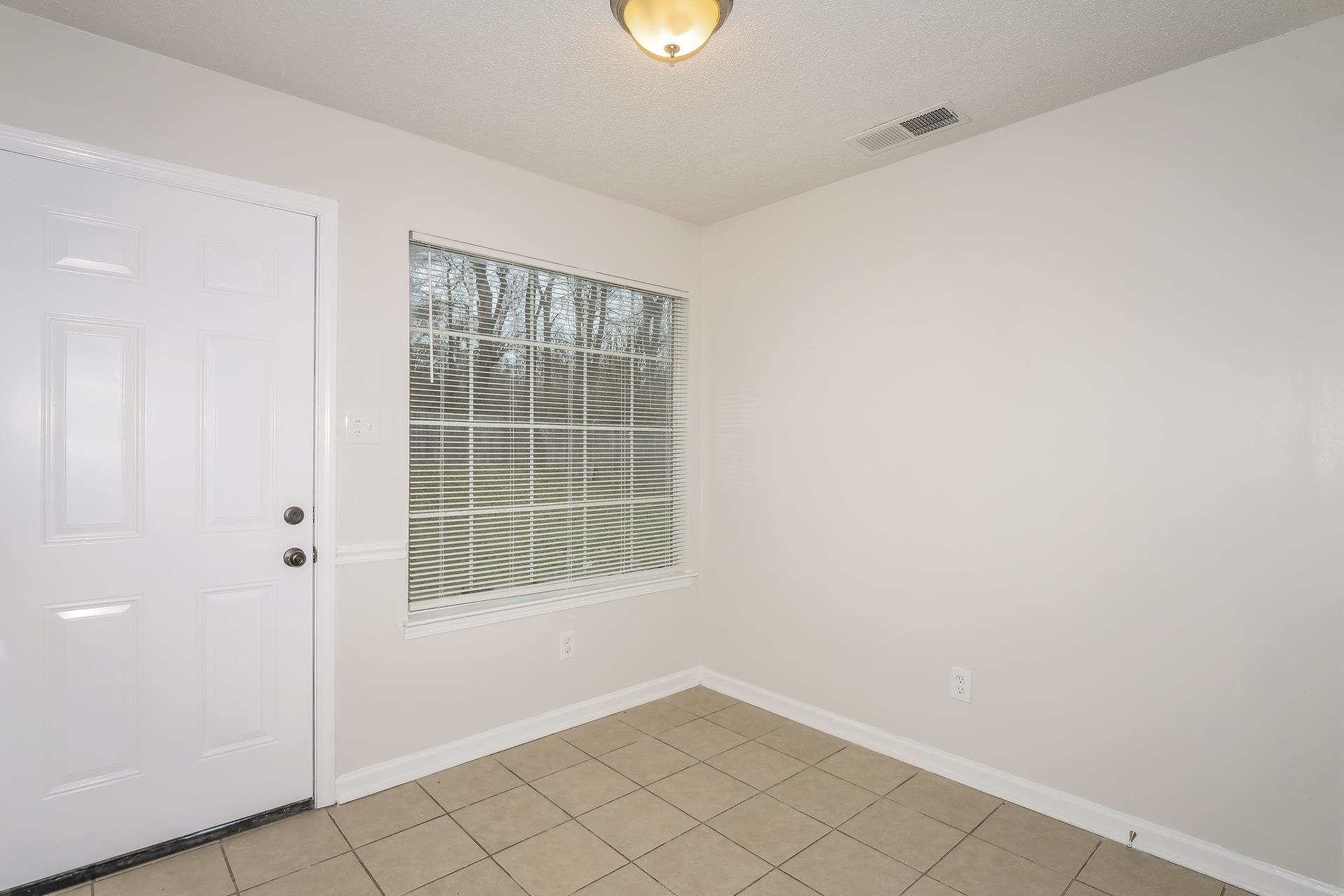 4696 Crestfield Road Millington, TN 38053 - Photo 5 of 17 Unfurnished room featuring baseboards and light tile patterned flooring