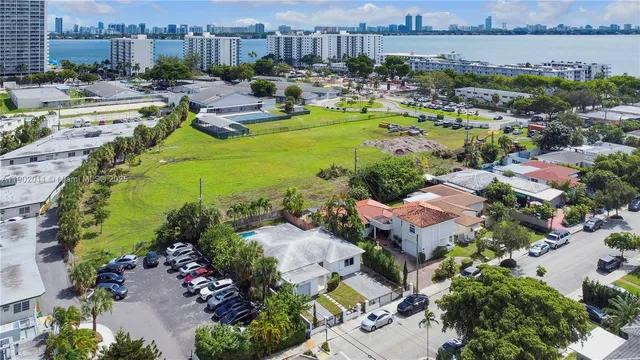 an aerial view of a house with yard swimming pool and outdoor seating