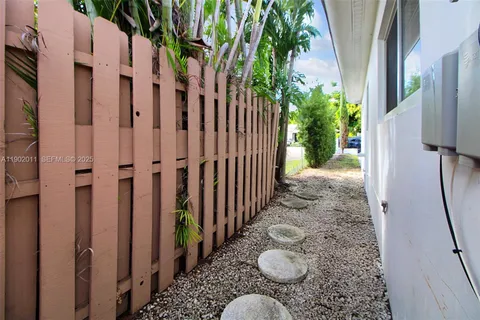 an aerial view of a house with swimming pool