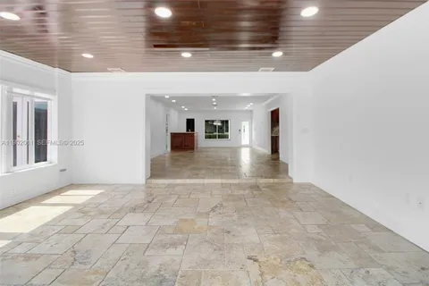 a view of a hallway with windows