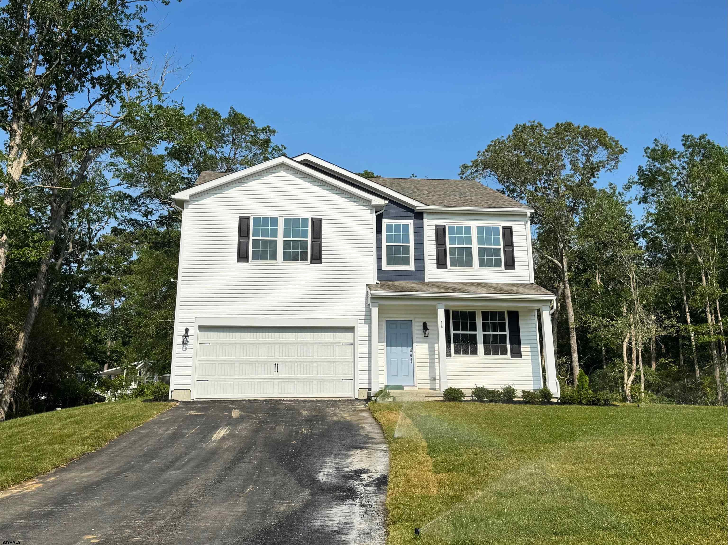 1564 Somers Point Road Egg Harbor Township, NJ 08234 - Photo 1 of 19 a front view of a house with a garden