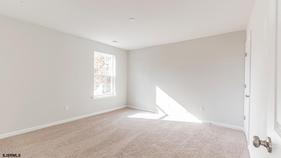 1564 Somers Point Road Egg Harbor Township, NJ 08234 - Photo 11 of 19 a view of a big room with windows and chandelier fan