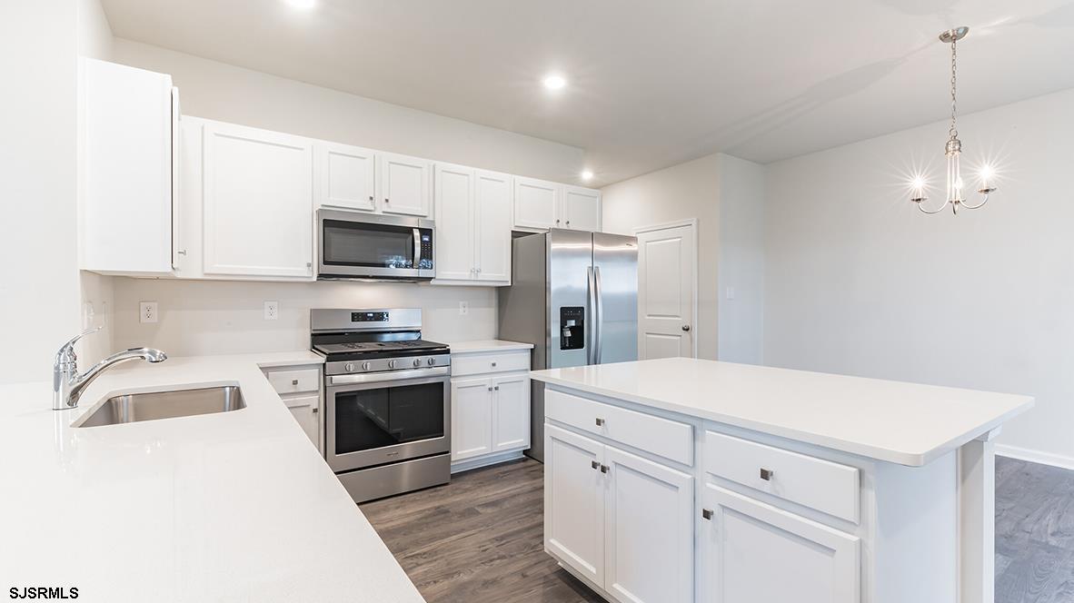 1564 Somers Point Road Egg Harbor Township, NJ 08234 - Photo 12 of 19 a kitchen with a sink a stove and refrigerator