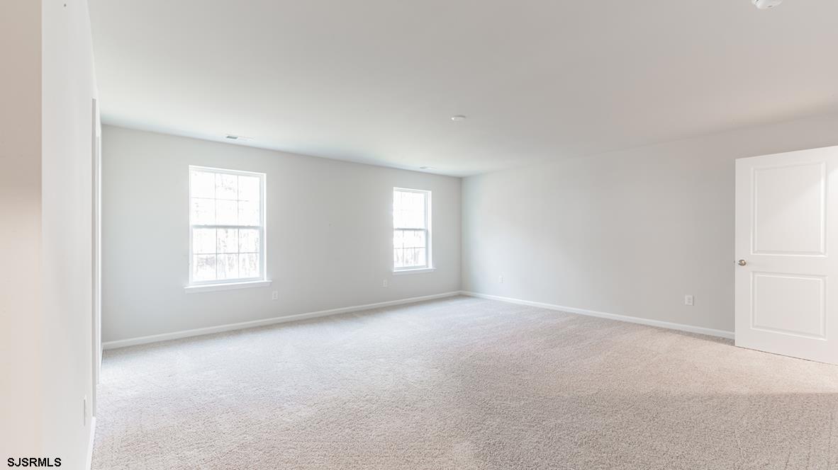1564 Somers Point Road Egg Harbor Township, NJ 08234 - Photo 14 of 19 an empty room with windows