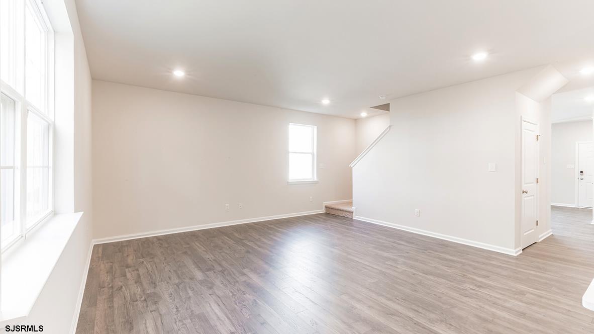 1564 Somers Point Road Egg Harbor Township, NJ 08234 - Photo 15 of 19 an empty room with wooden floor and window